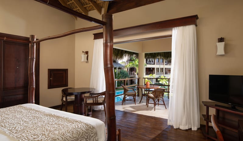 ROMANTIC JUNIOR SUITE POOL VIEW INDOOR BEDROOM